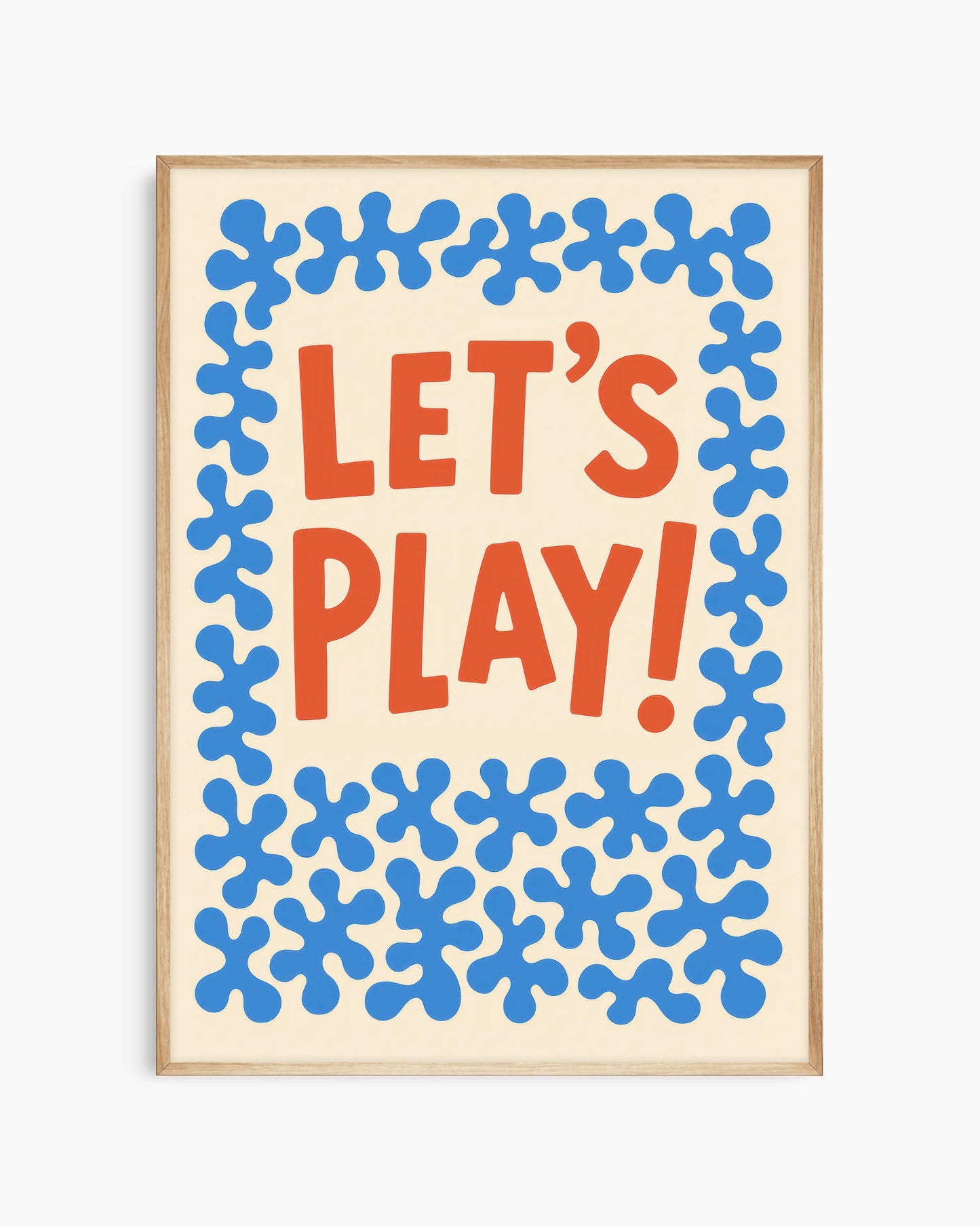 Poster with 'LET'S PLAY!' text in red and blue patterns on a beige background with an oak frame.