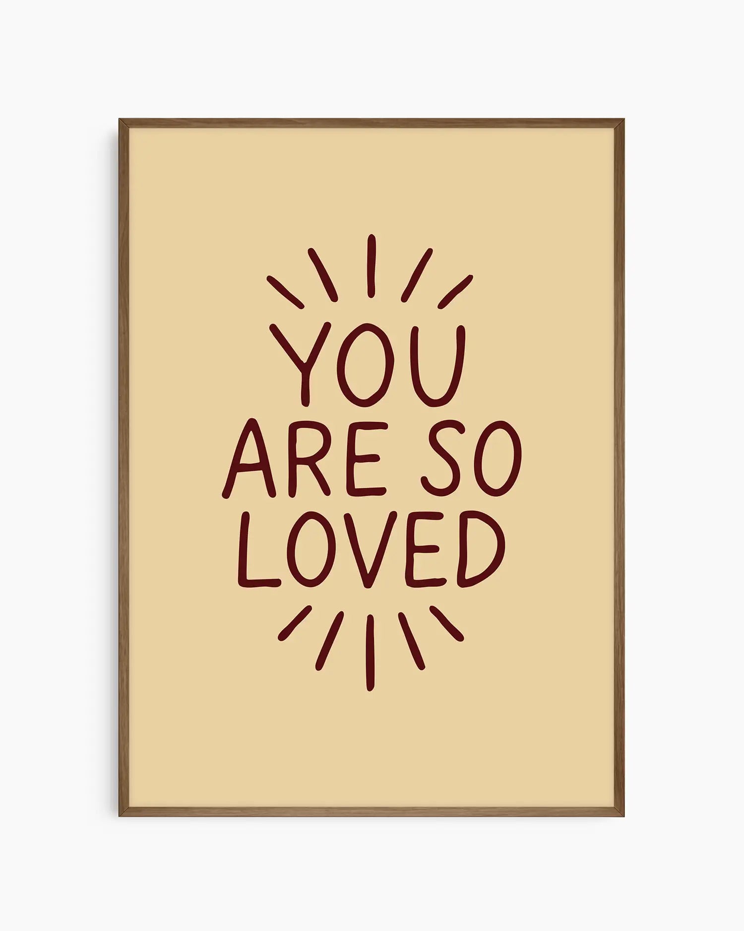 Children's poster with 'You are so loved' text framed in a dark oak frame.
