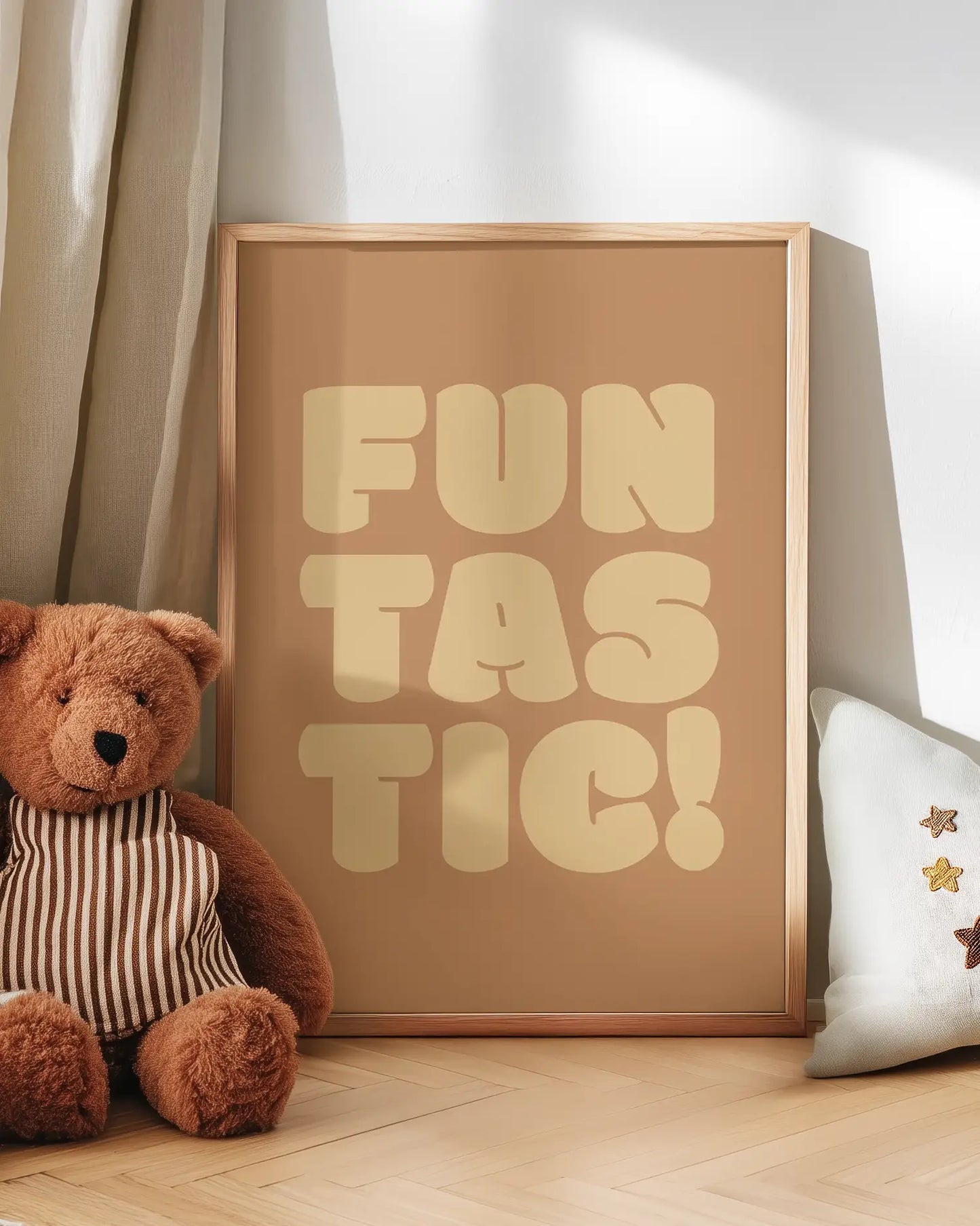Poster with 'FUN TASTIC!' text next to a teddy bear on a wooden floor.