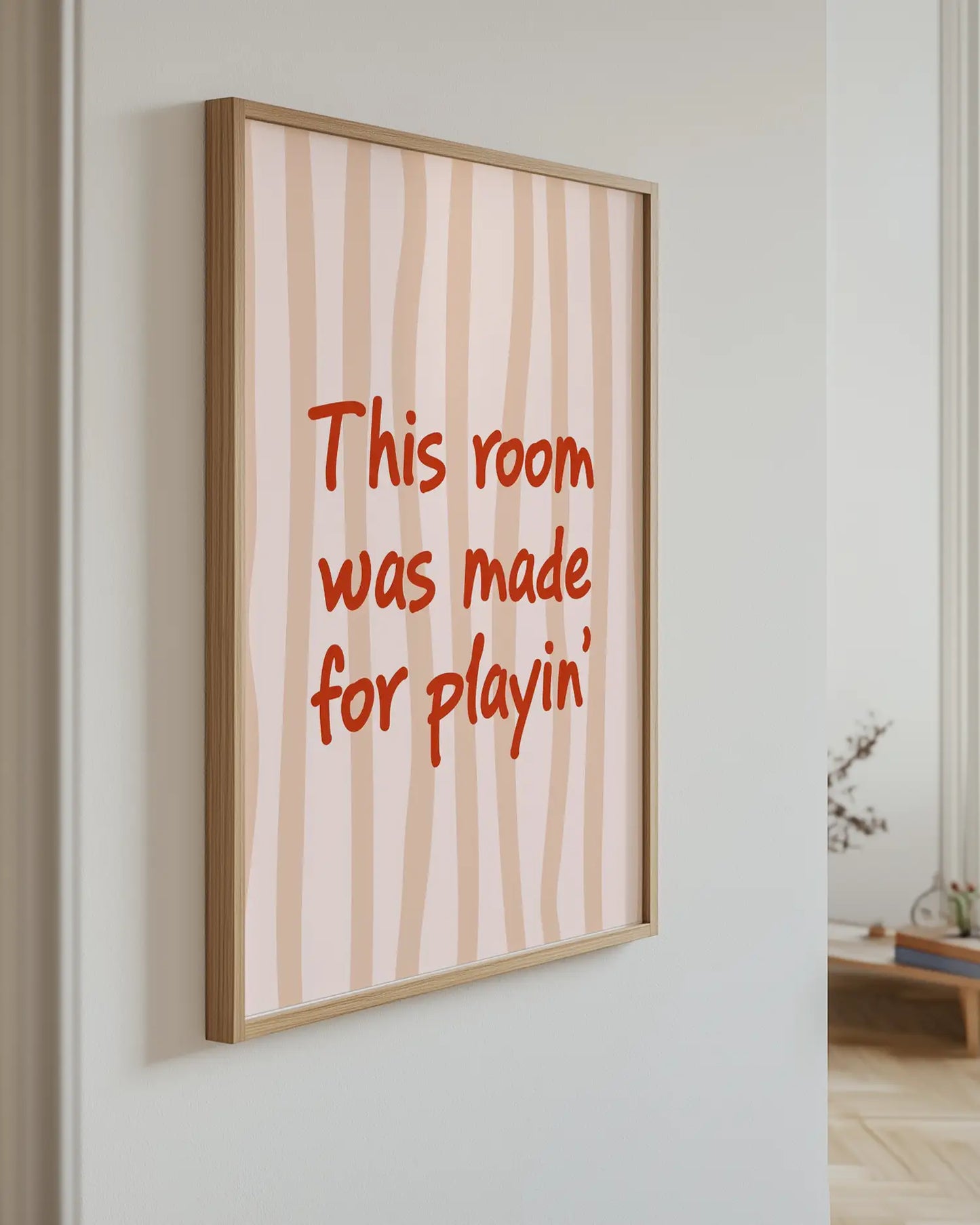 Poster with the text "This room was made for playin'" on the wall