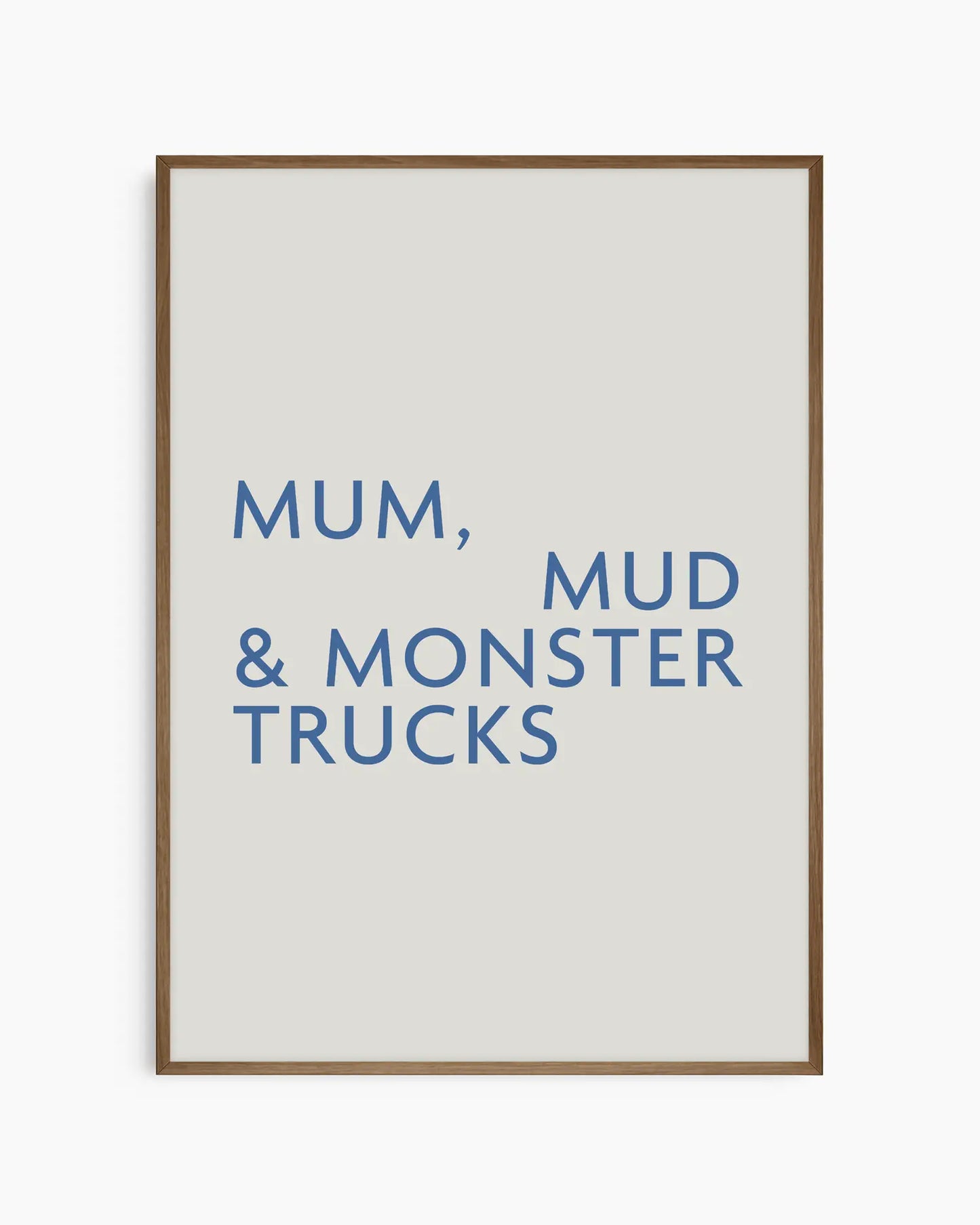 Poster with text 'Mum, Mud & Monster Trucks' in a dark wooden oak frame.