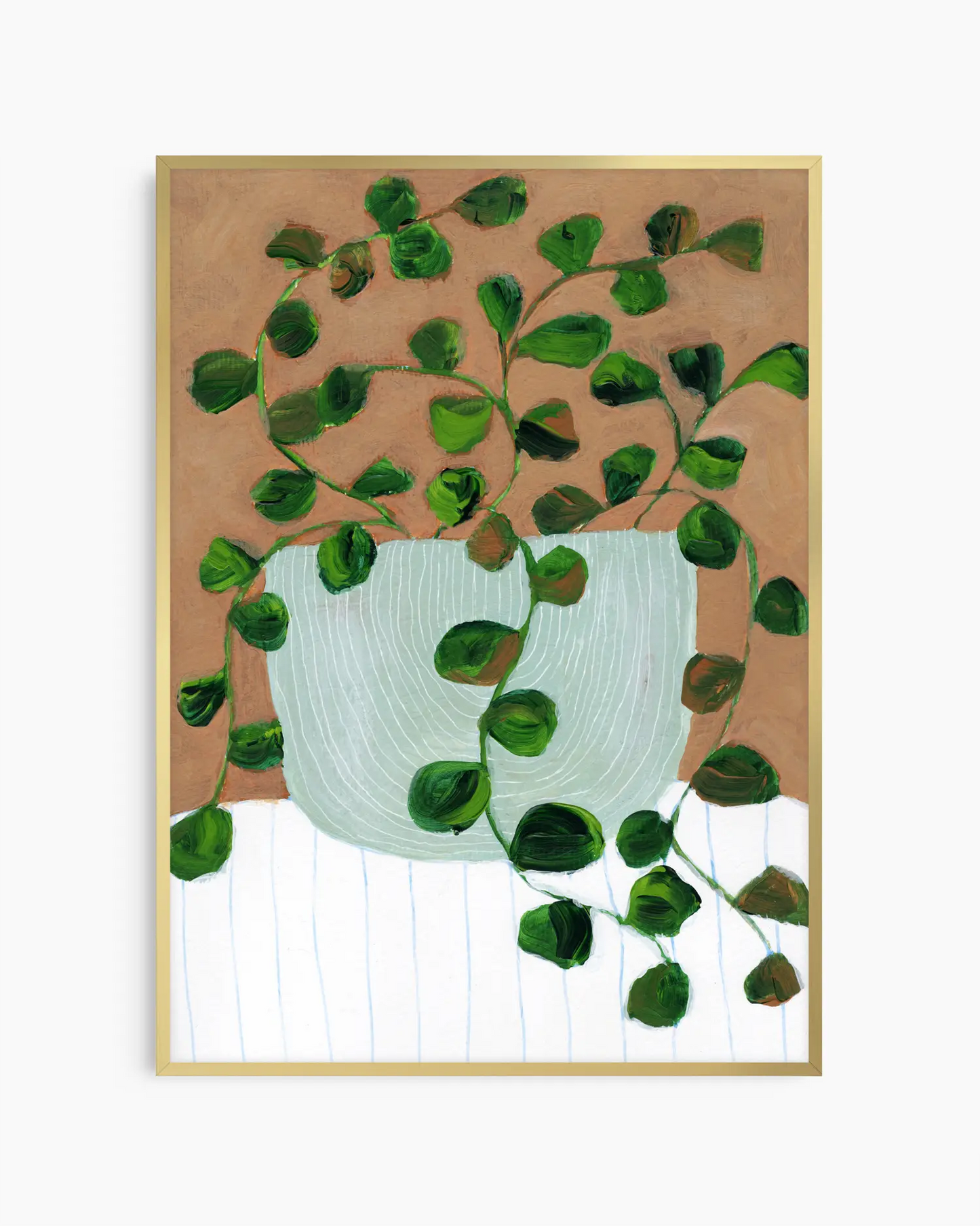 Framed artwork of a green leafy plant in a white pot on a brown background
