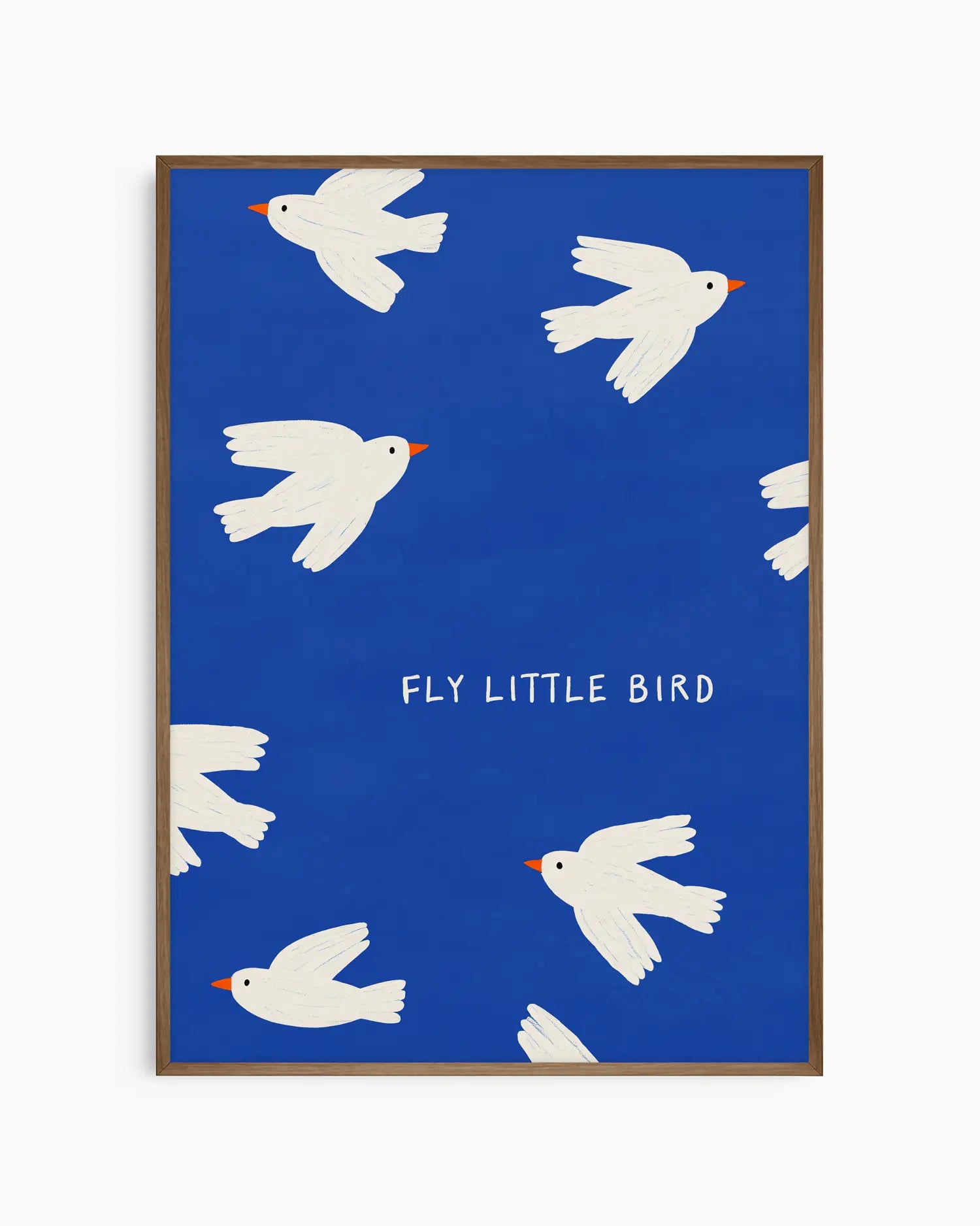 Framed artwork with white birds on a blue background and 'Fly Little Bird' text.