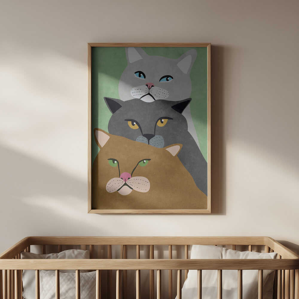 Stylish cat nursery print with three stacked cats in neutral and pastel tones, hanging in a light wooden frame above a baby’s crib. The minimalist design and soothing colors make it a perfect wall art piece for a modern, animal-themed nursery.