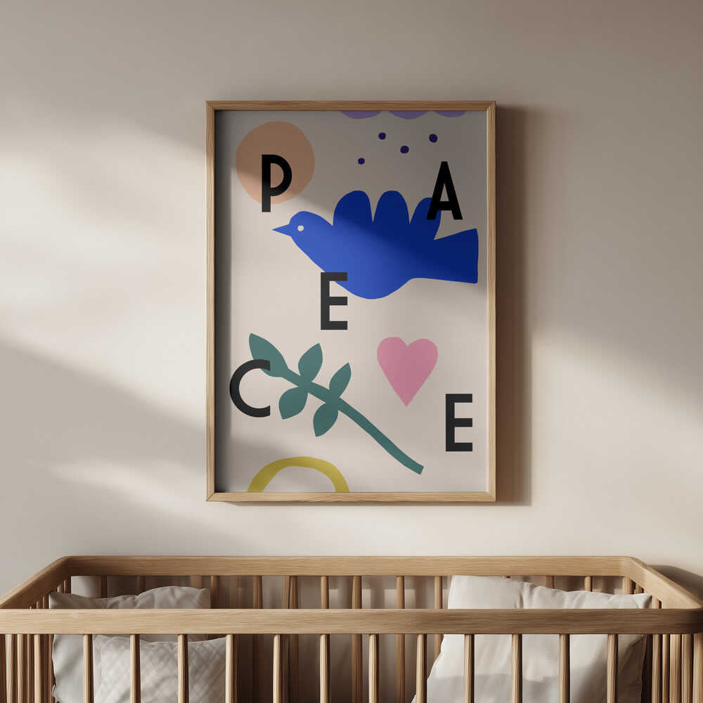 Framed 'PEACE' poster with a bird and a heart hanging in the nursery