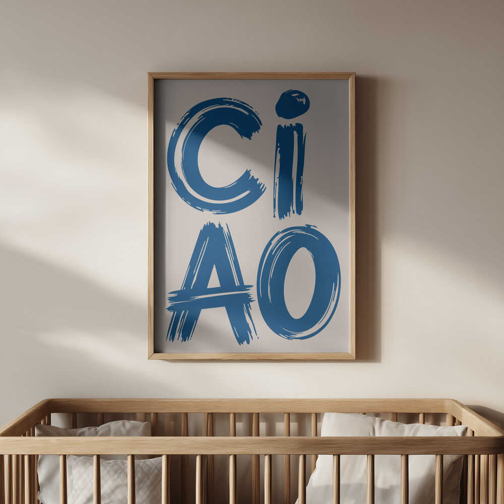 Framed poster with the text 'CIAO' written in blue hanging above the bed in the nursery.