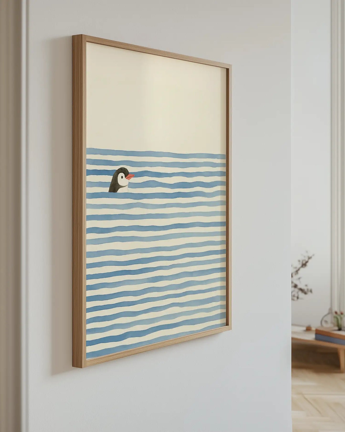 Artwork of a penguin in water with blue and white stripes on a wall.