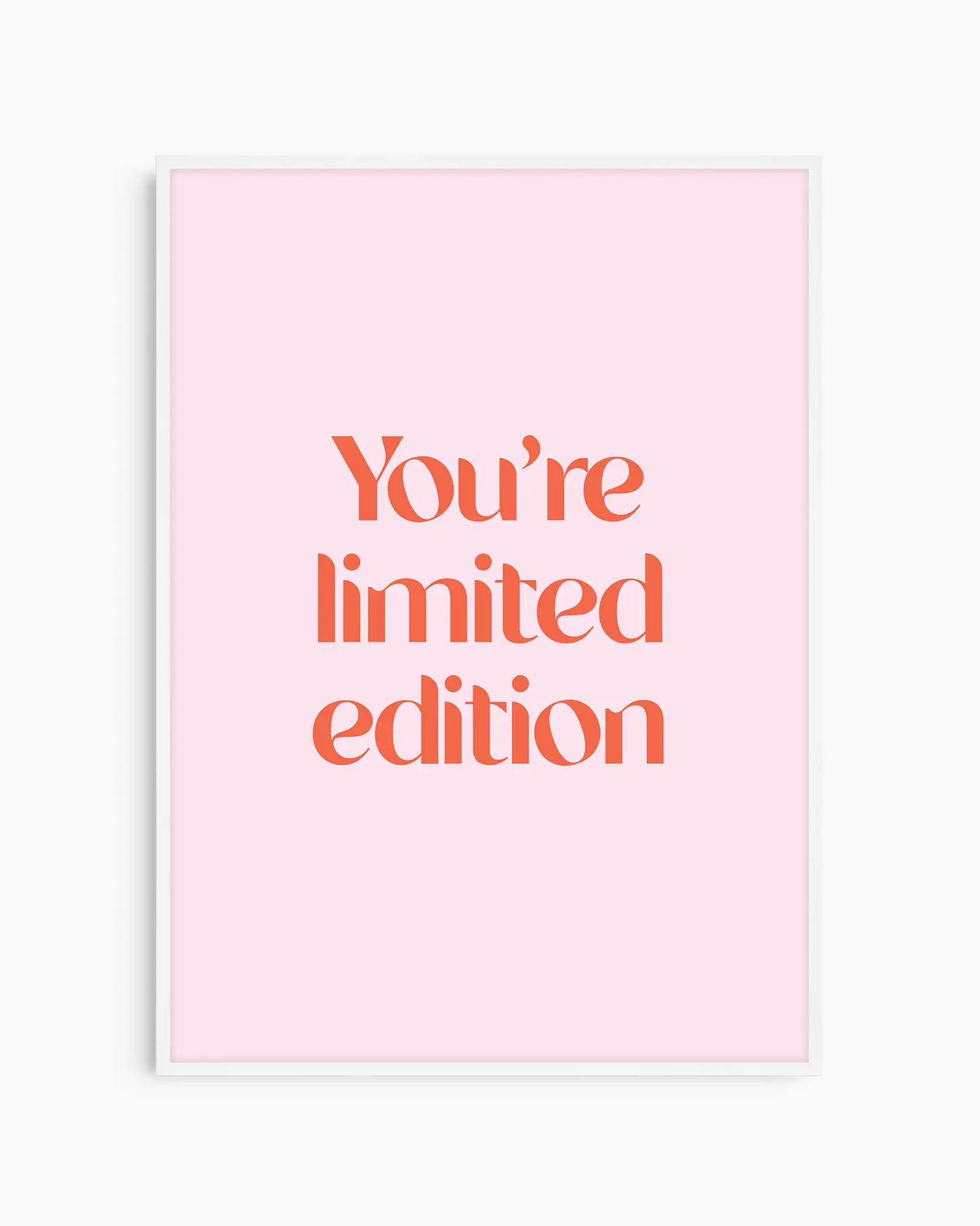 Children's poster with red text 'You're limited edition' on a pink background framed in a white frame.