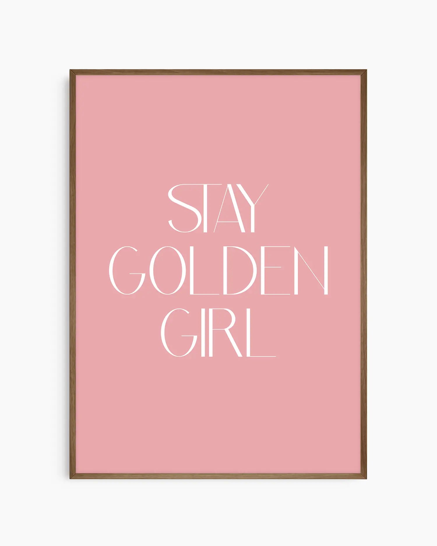 Nursery poster with 'Stay Golden Girl' text on a pink background framed in a dark oak frame
