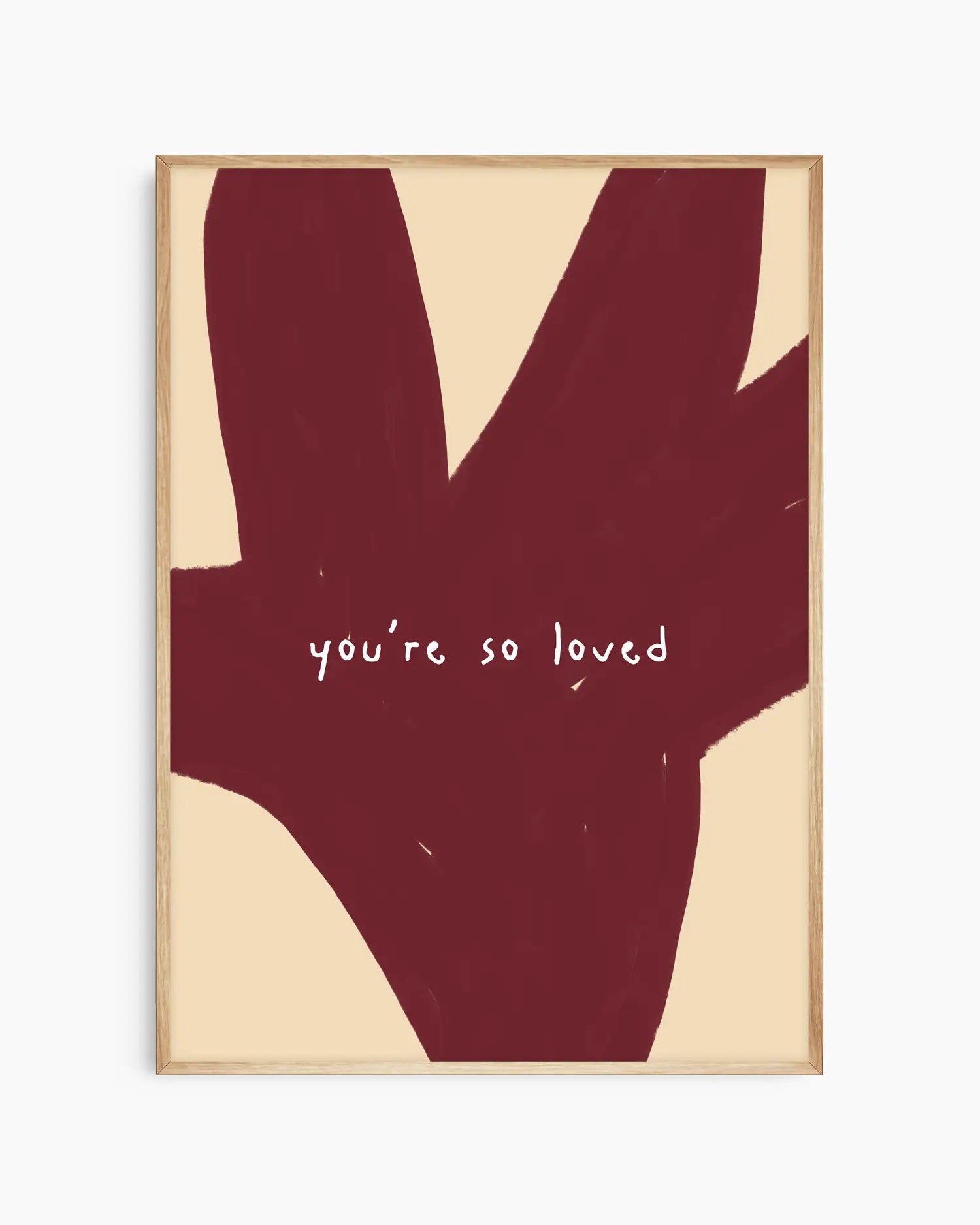 Red and beige nursery poster with the text 'you're so loved' framed in an oak frame.