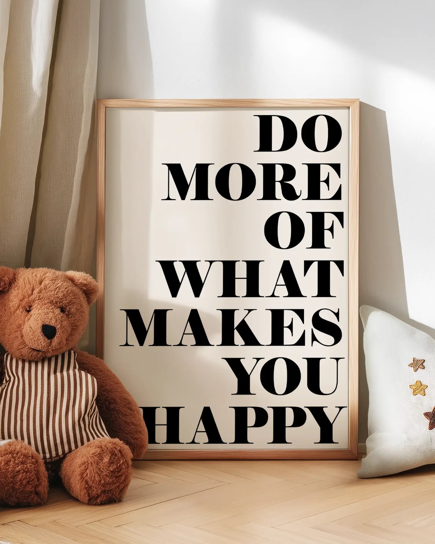 Motivational poster with teddy bear and pillow on a wooden floor
