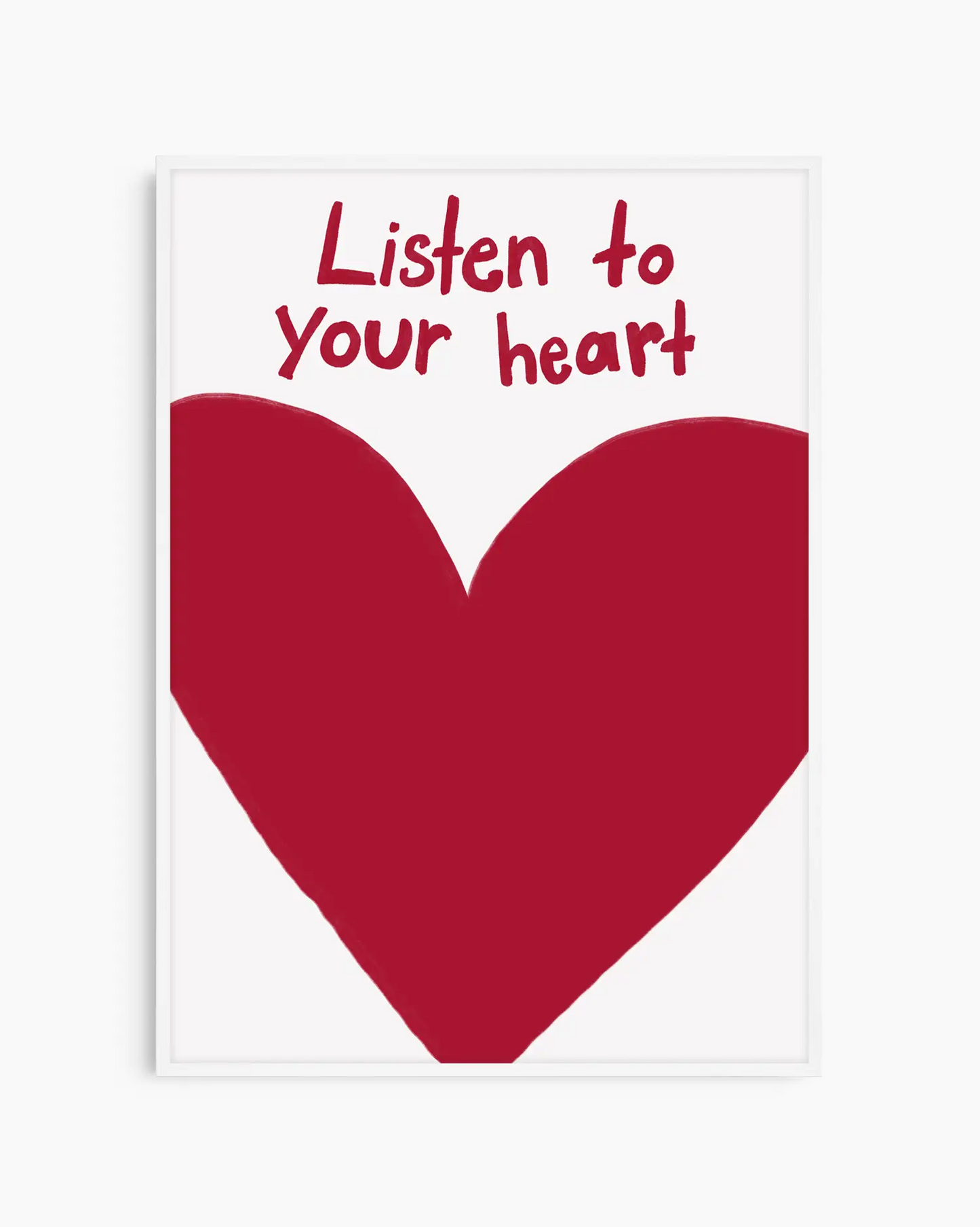 Framed poster with a red heart and 'Listen to your heart' text on a white background