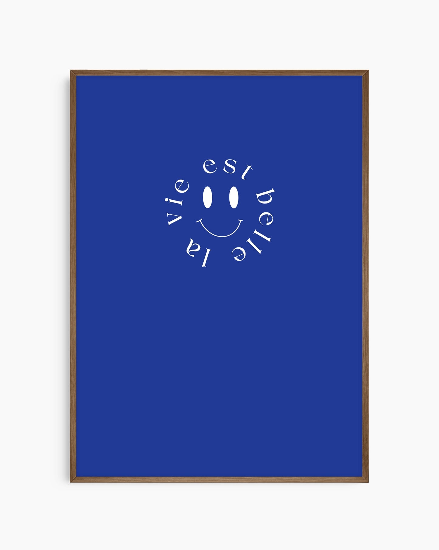 Framed poster with 'La vie est belle' text and smiley face on a blue background