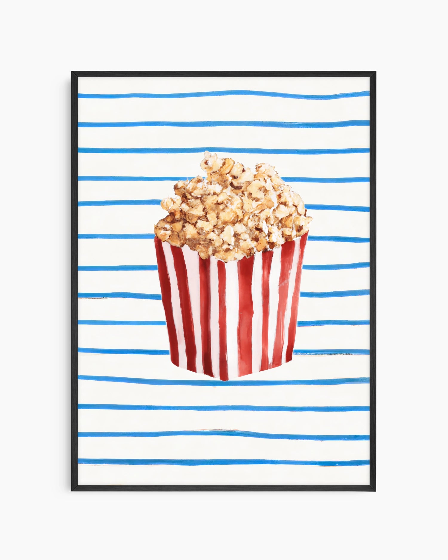 Popcorn in a red and white striped bucket on a blue and white striped background