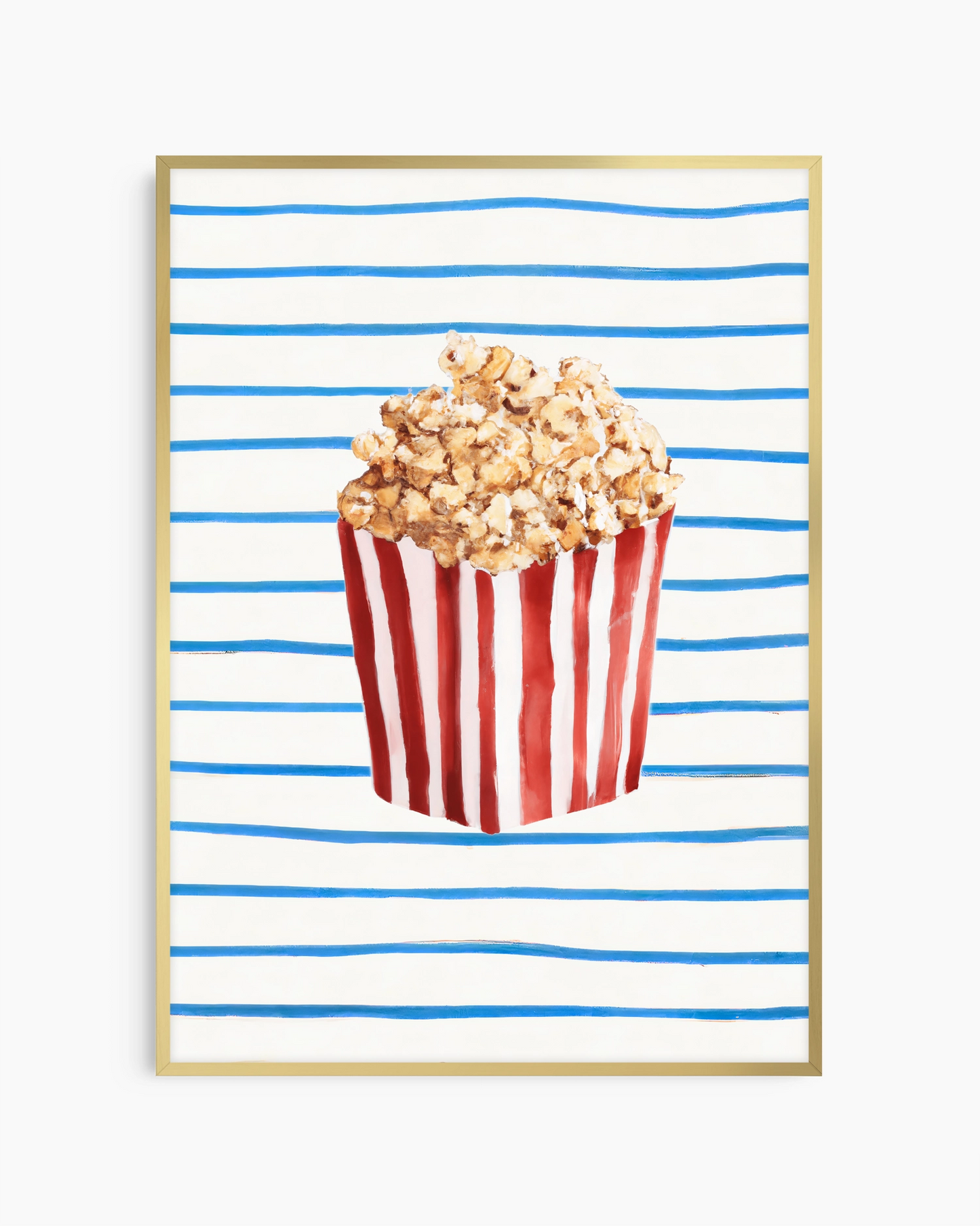 Popcorn in a red and white striped bucket on a blue and white striped background