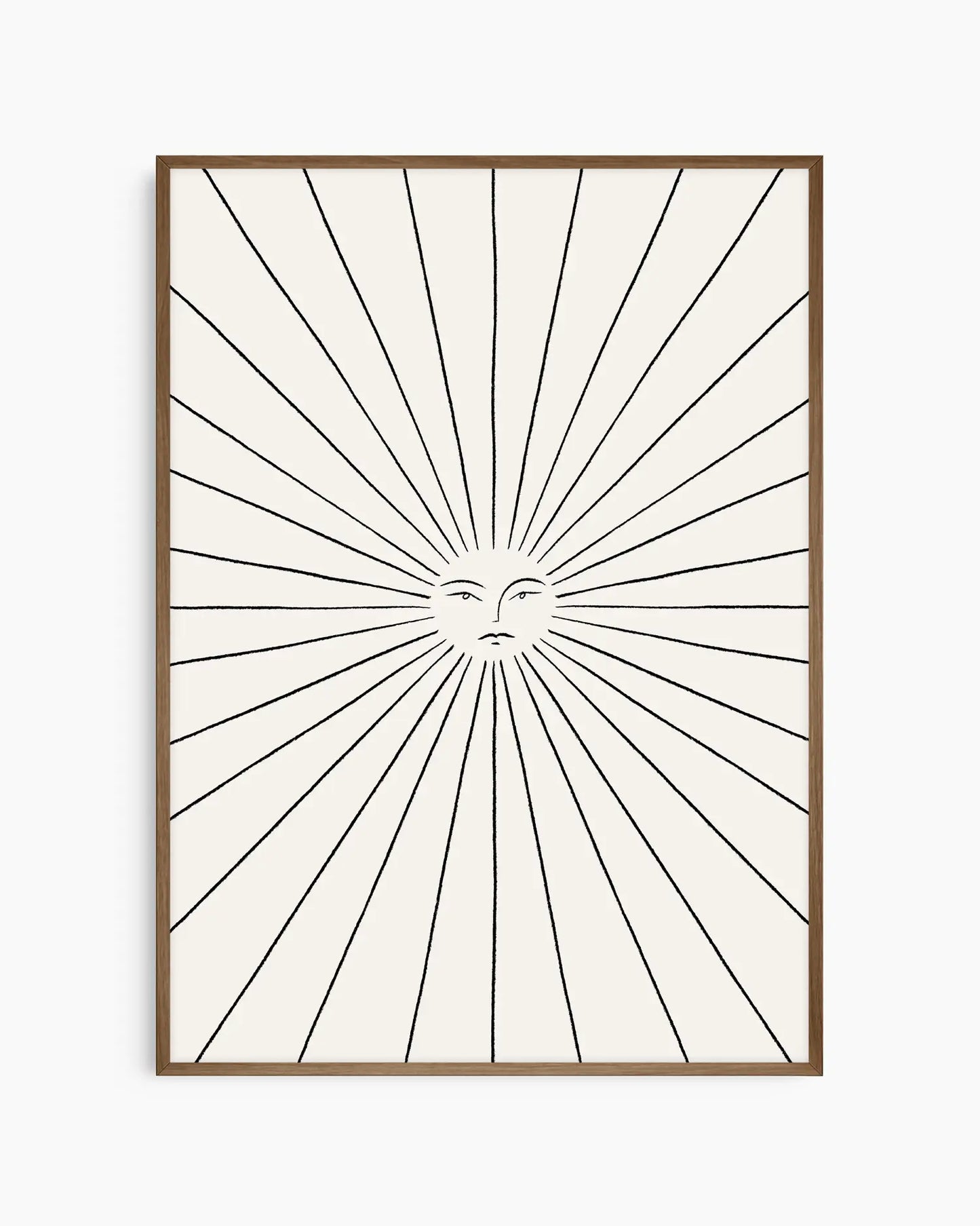 Framed artwork with sunburst design and face in the center on a white background