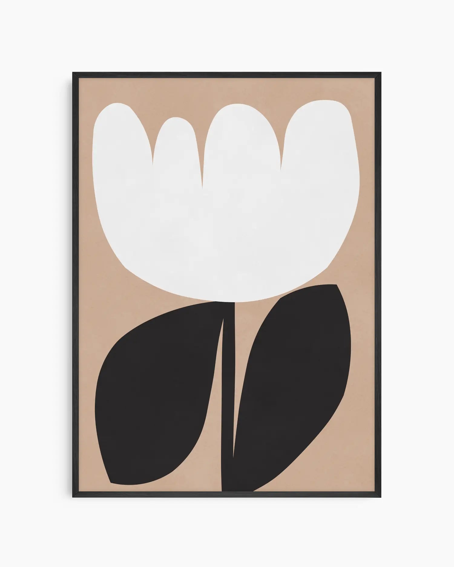 Framed artwork of a white flower with black leaves on a beige background