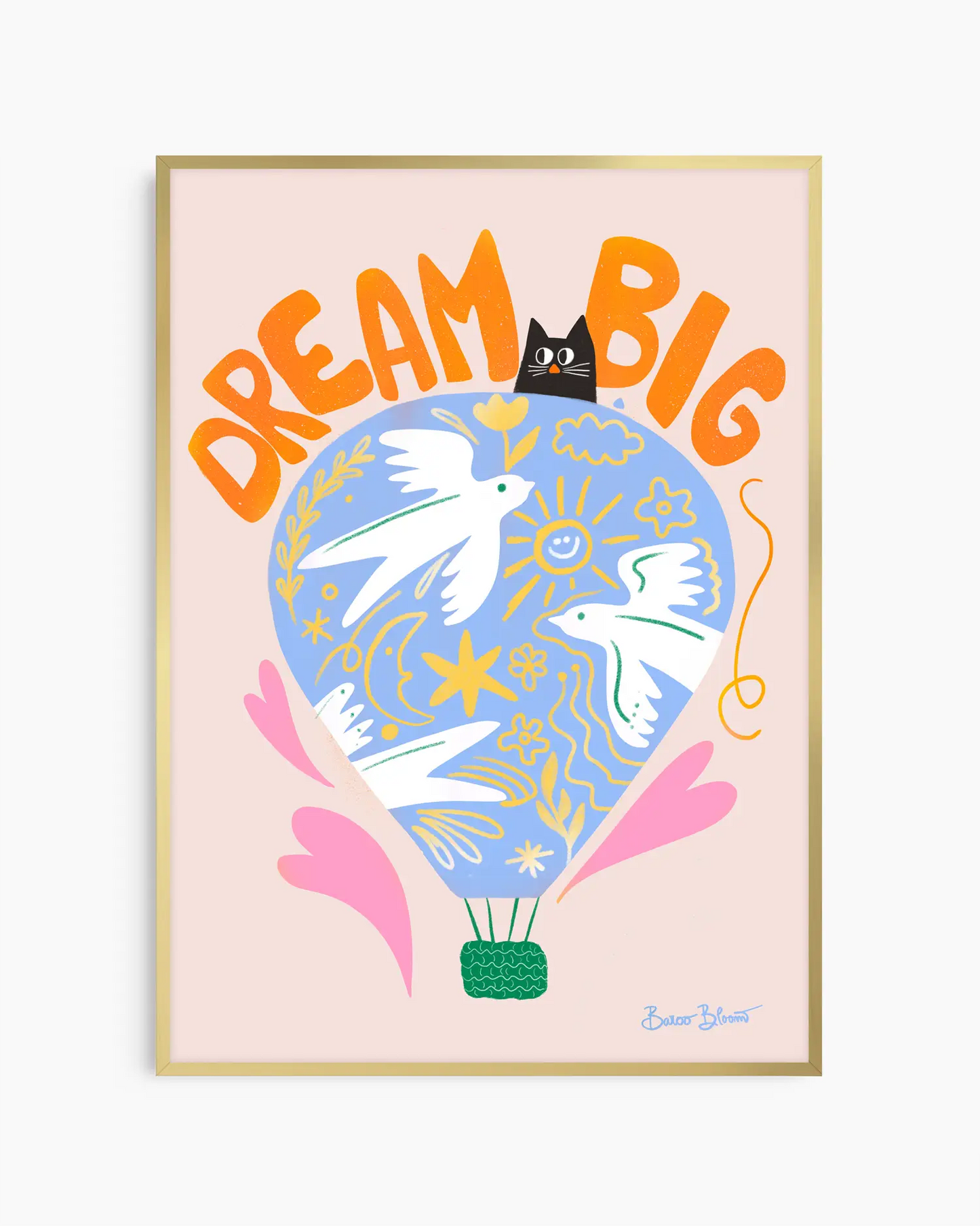 Nursery artwork with a colorful illustration of a hot air balloon, birds, and text "Dream big" on a light pink background. Framed in a gold frame.