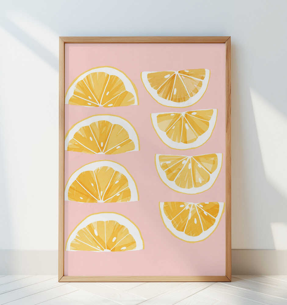 Framed poster of orange slices on a pink background
