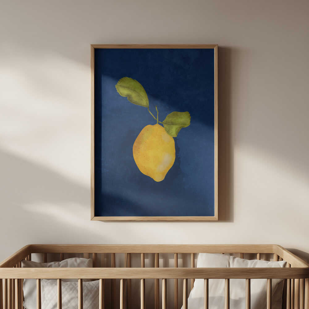 Framed lemon botanical print hanging above wooden crib. Calming hand-painted citrus artwork with rich blue tones, creating a warm and natural nursery atmosphere.