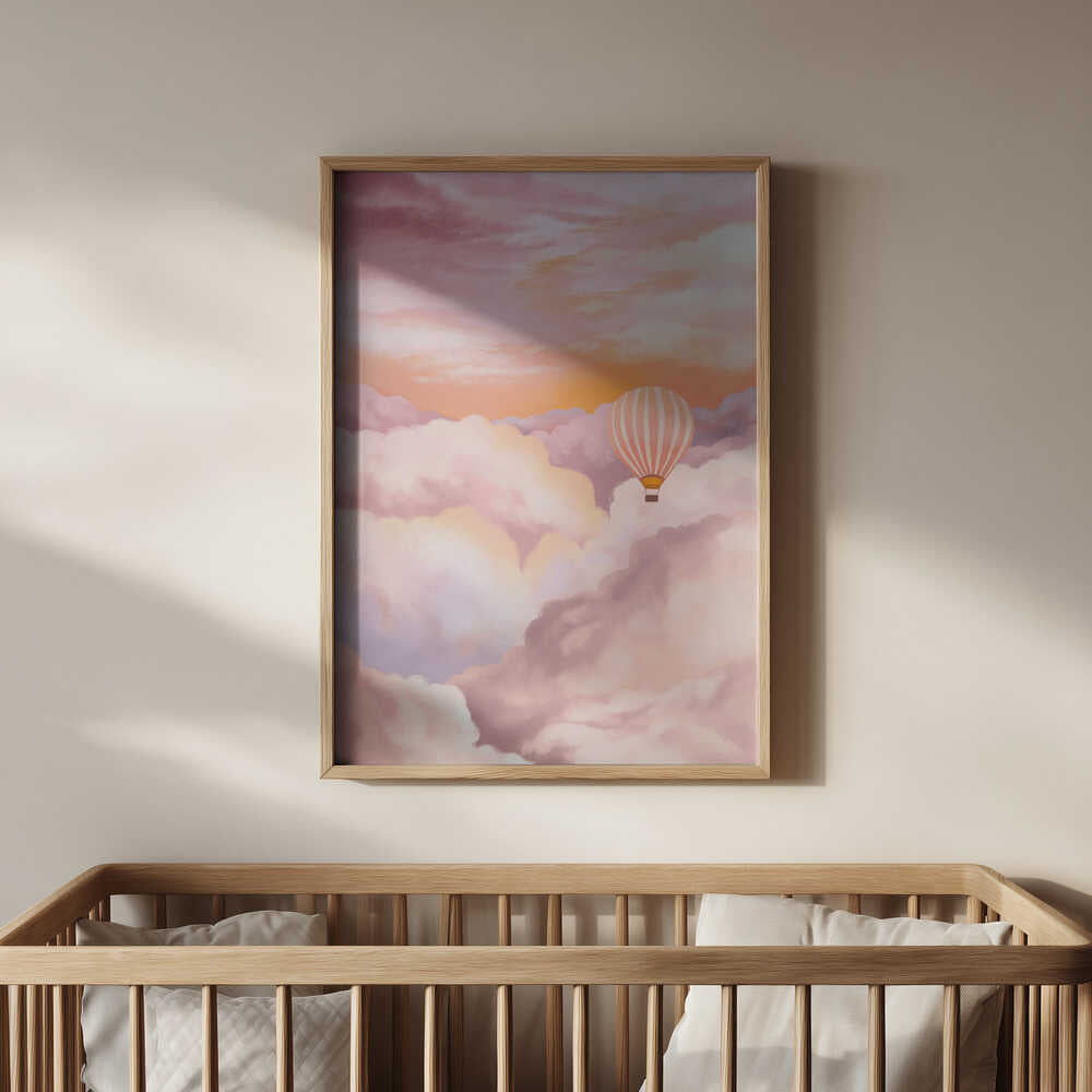 Soft pastel art print featuring a hot air balloon drifting among clouds, framed in light wood and hanging above a baby’s crib. A soothing and magical wall art piece that adds warmth and serenity to a modern nursery.